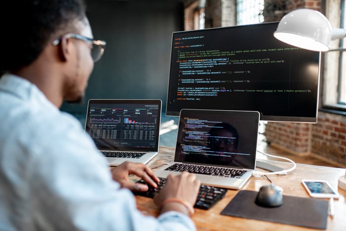 A coder working on a computer.