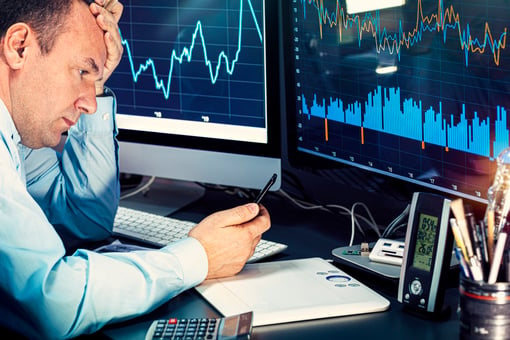 frustrated-investor-looking-at-stock-charts-getty